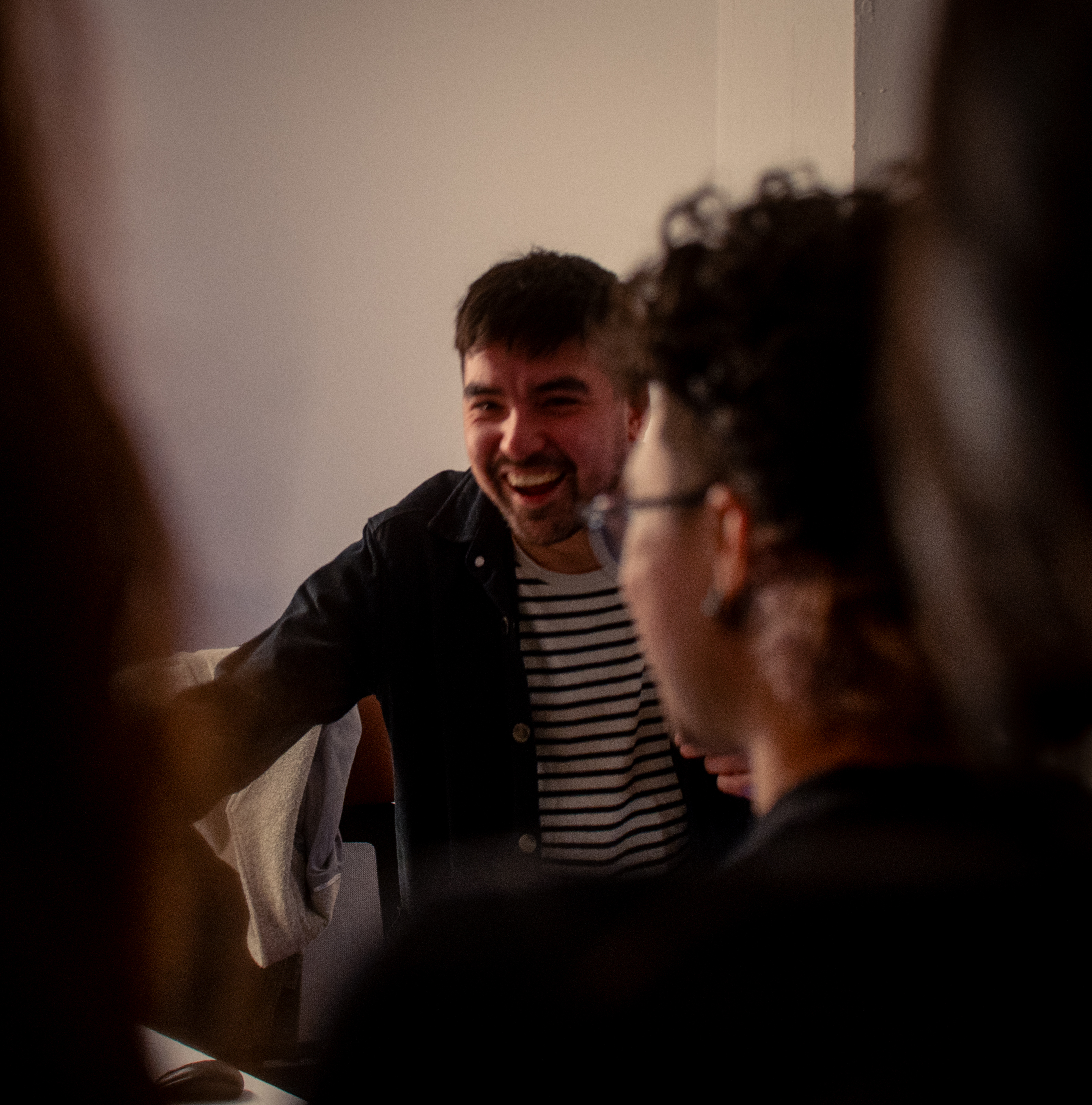 Myth Labs team laughing in the studio